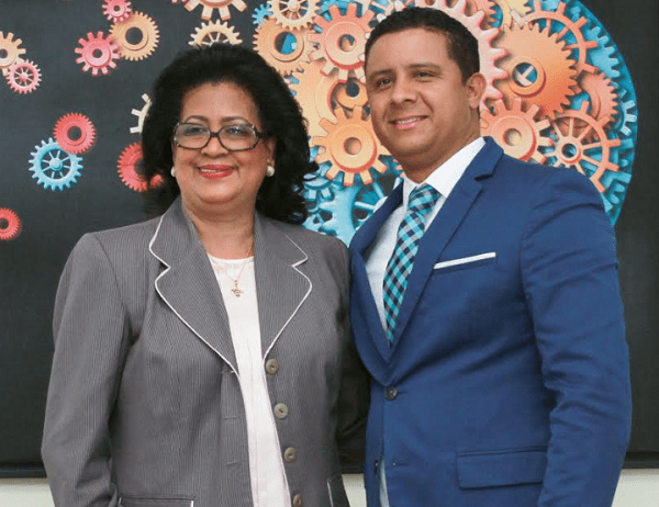 Rector Milton Reyes recibe visita senadora Cristina Lizardo.